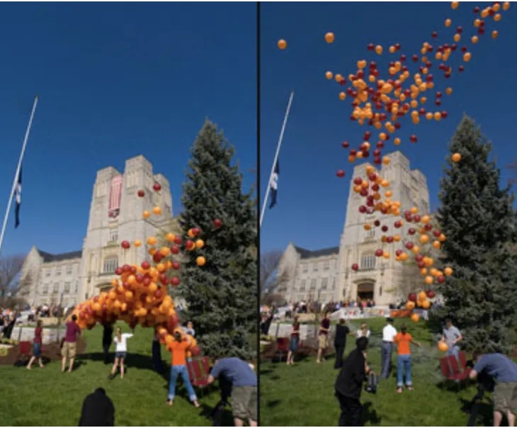 Image shows the release of dark red and orange balloons into the blue sky in front of Burress Hall at Virginia Tech.