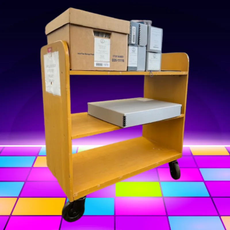 wooden library cart with archives boxes on the top and middle shelve. Background is a disco dance floor
